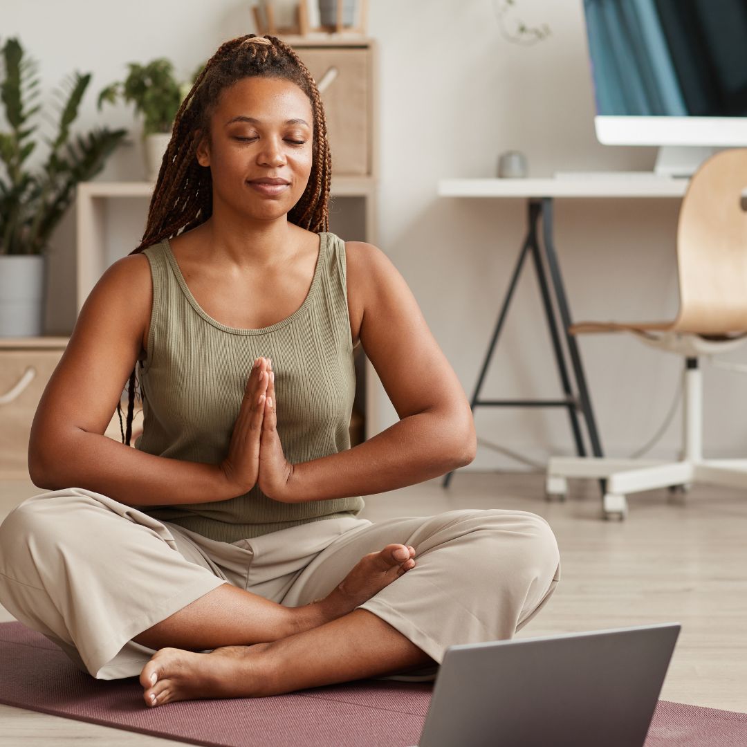 woman meditating at home